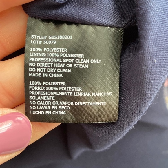 GB formal gown in navy with embroidered pink, yellow, and blue flowers. - Picture 12 of 15